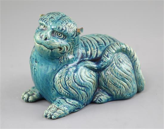A Japanese turquoise glazed pottery model of a recumbent lion, c.1900, length 18cm